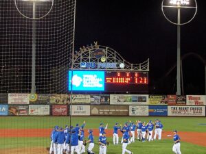 Israel’s baseball team, seen here during a past celebration at MCU Park in Brooklyn, now faces a tough road ahead after falling to the Netherlands in a recent matchup. As the scoreboard glows under night lights, the team’s earlier triumph contrasts sharply with its current challenge in the international baseball rankings.